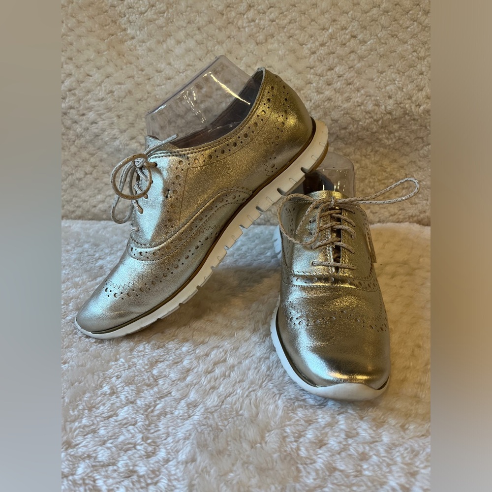 Cole Haan Gold and White Flats Sleek Design